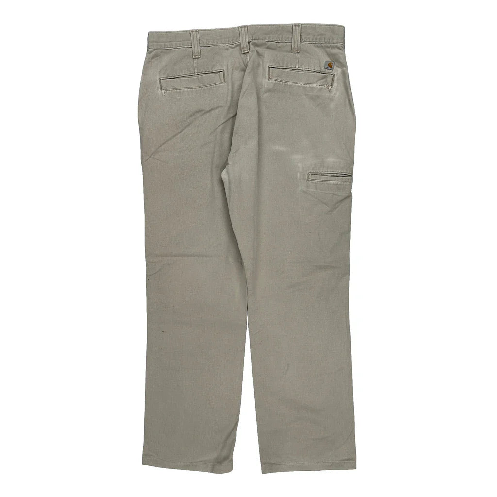 Buy Carhartt Trousers - 36W 29L Beige Cotton Refurbished - $29.47 Carhartt Trousers - 36W 29L Beige Cotton Refurbished - Thrifted (note: this is a term often used to describe second- refurbished available on Cerqular
