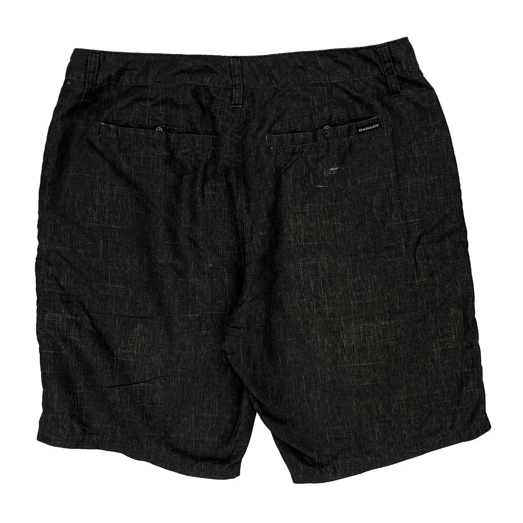 Oakley Shorts - 34W 10L Black Polyester Refurbished - Thrifted (note: this is a term often used to describe second- refurbished available on Cerqular