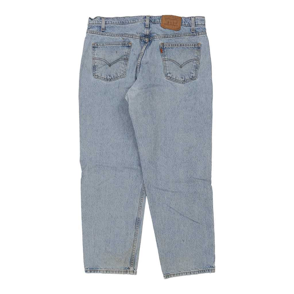 550 Orange Tab Levis Jeans - 38W 30L Light Wash Cotton Refurbished - Thrifted (note: this is a term often used to describe second- refurbished available on Cerqular