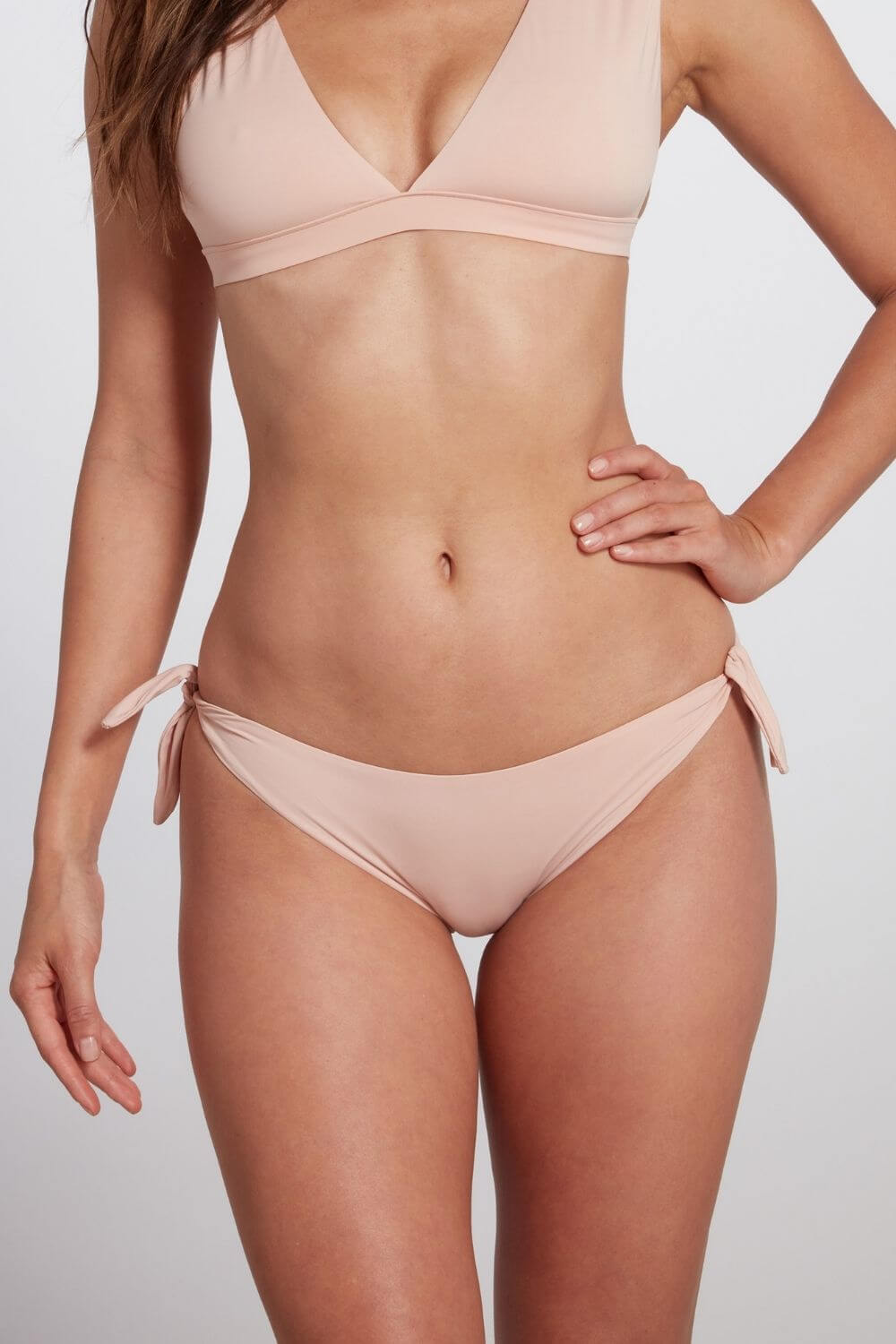 Buy Fanny Tie Side Bikini Bottom in Blush | Size: Medium Refurbished - $102.00 Fanny Tie Side Bikini Bottom in Blush | Size: Medium Refurbished - Sauipe Swim refurbished available on Cerqular
